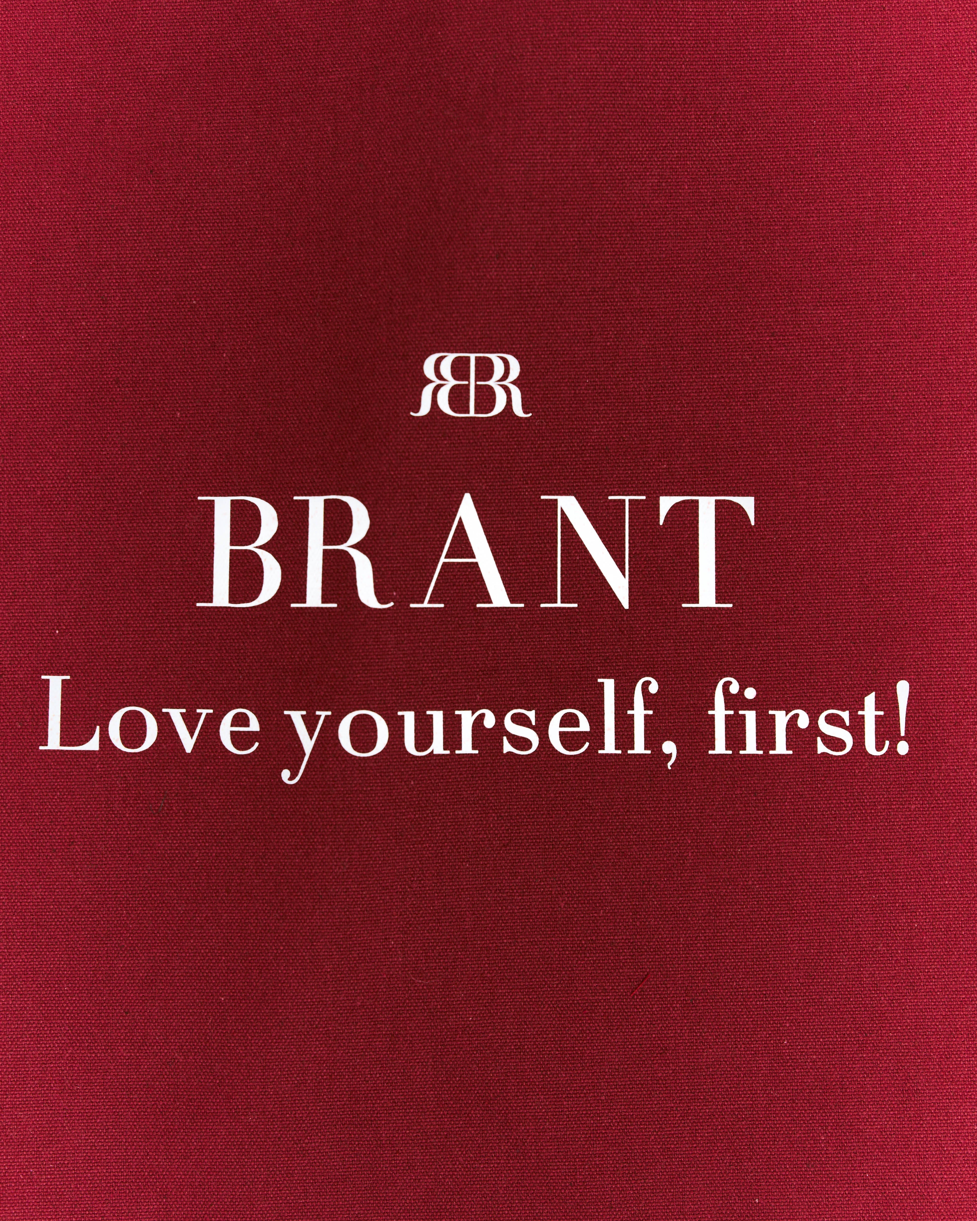 Red book cover with 'BRANT' and 'Love yourself, first!' text on a red background